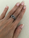 Band carved broad braided ring